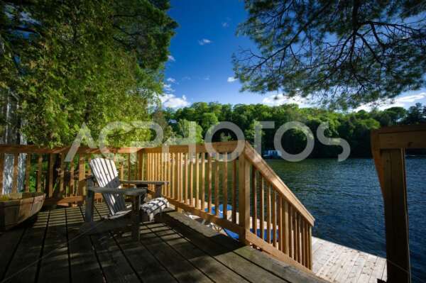 Adirondack chair on a cottage deck 2880
