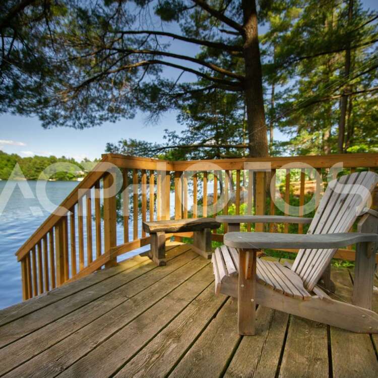 Adirondack chair sitting on a cottage wooden deck 2946