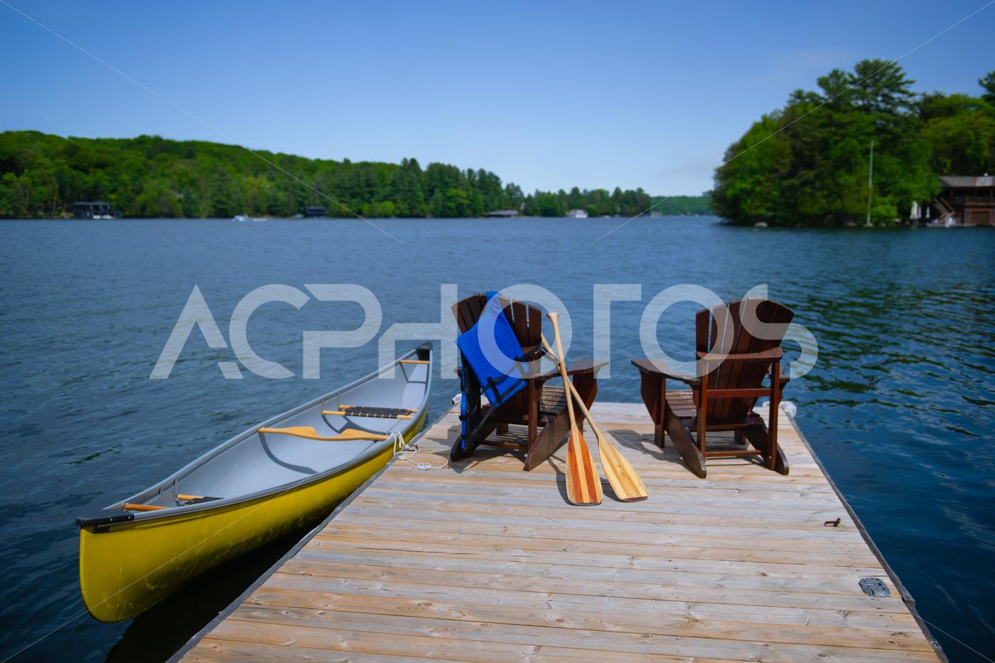 Adirondack chairs canoe and paddles 2796