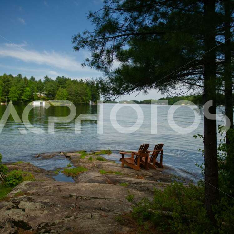 Adirondack chairs near the water - Alessandro Cancian Photography