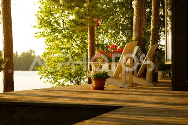 Adirondack chairs on a cottage deck 2570
