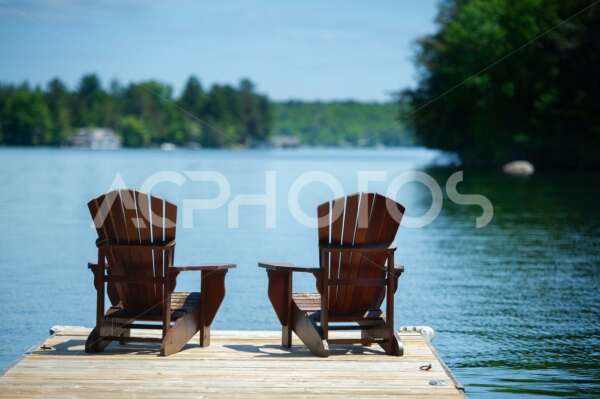 Adirondack chairs on a cottage dock 2736