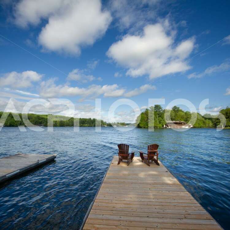 Adirondack chairs on a wooden dock 2844