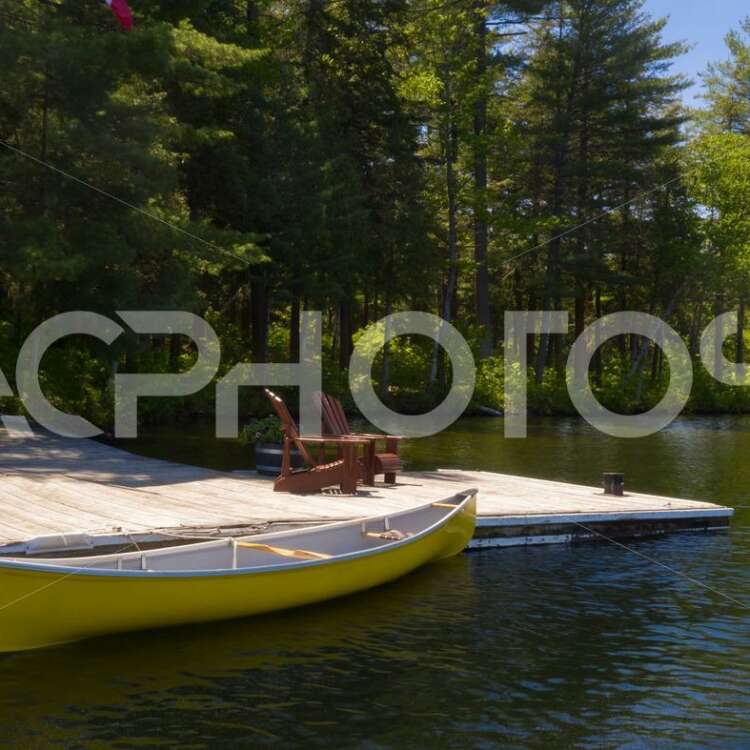 Adirondack chairs on a wooden dock 3000