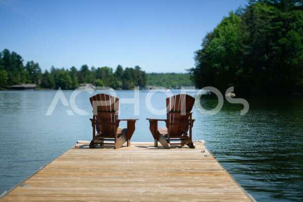 Adirondack chairs on a wooden dock 3035