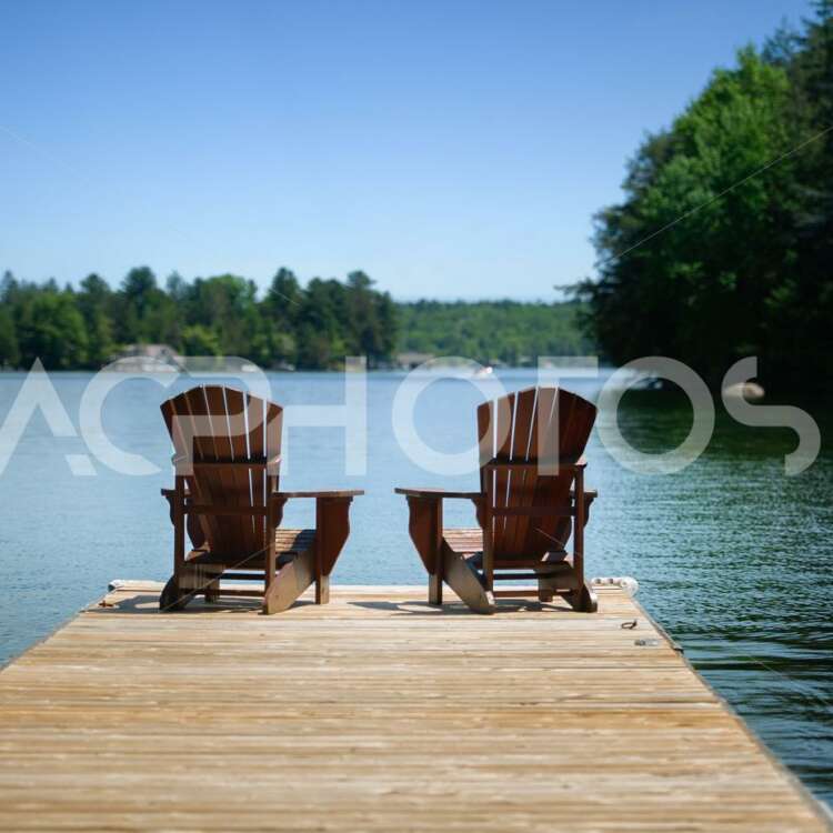 Adirondack chairs on a wooden dock - Alessandro Cancian Photography
