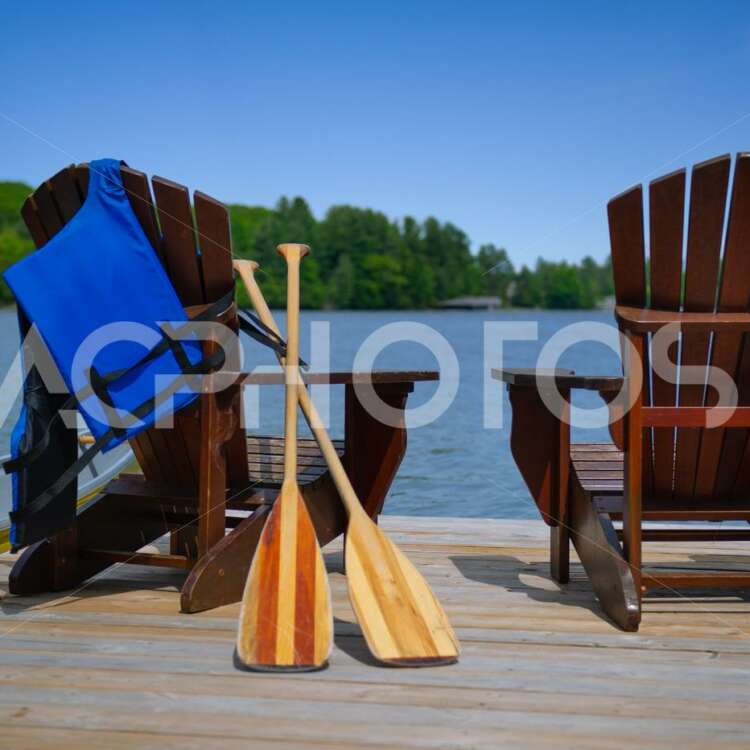 Adirondack chairs with canoe paddles and life jacket 2802