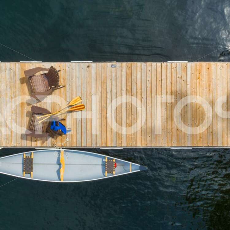 Aerial view of Adirondack chairs and canoe - Alessandro Cancian Photography