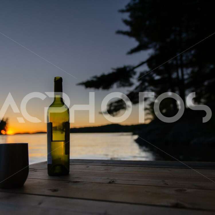 Bottle of wine and a tumbler glass at sunset - Alessandro Cancian Photography