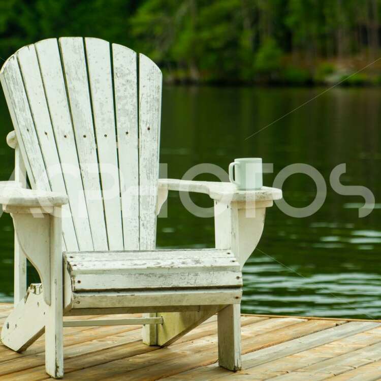 Coffee mug sitting on a white Adirondack chair - Alessandro Cancian Photography