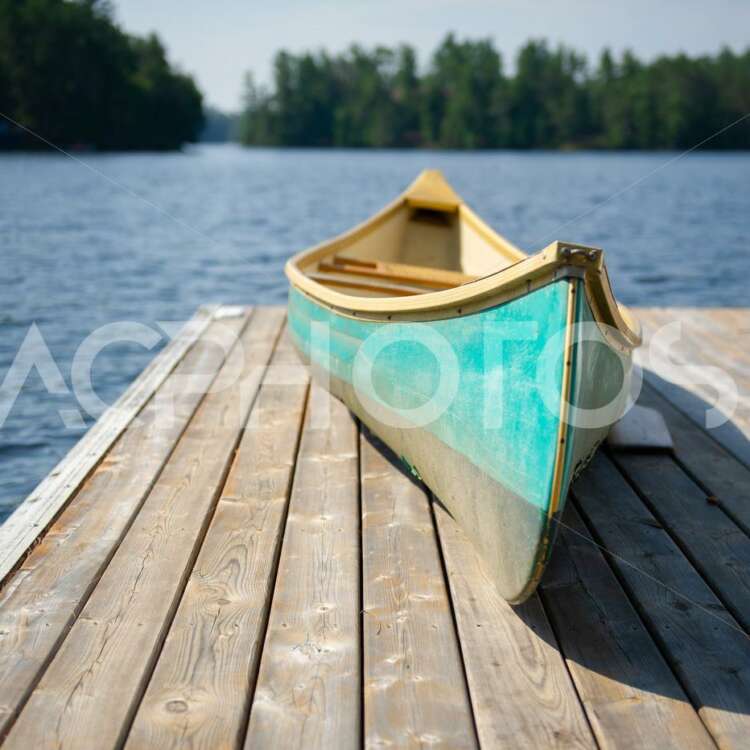 Green canoe on wooden pier 2534
