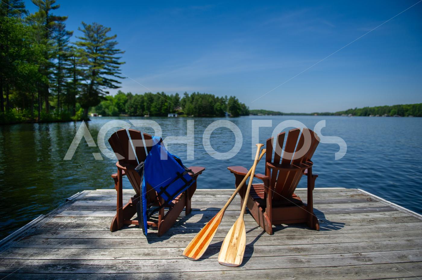 Life jacket paddles on Adirondack chairs 2760