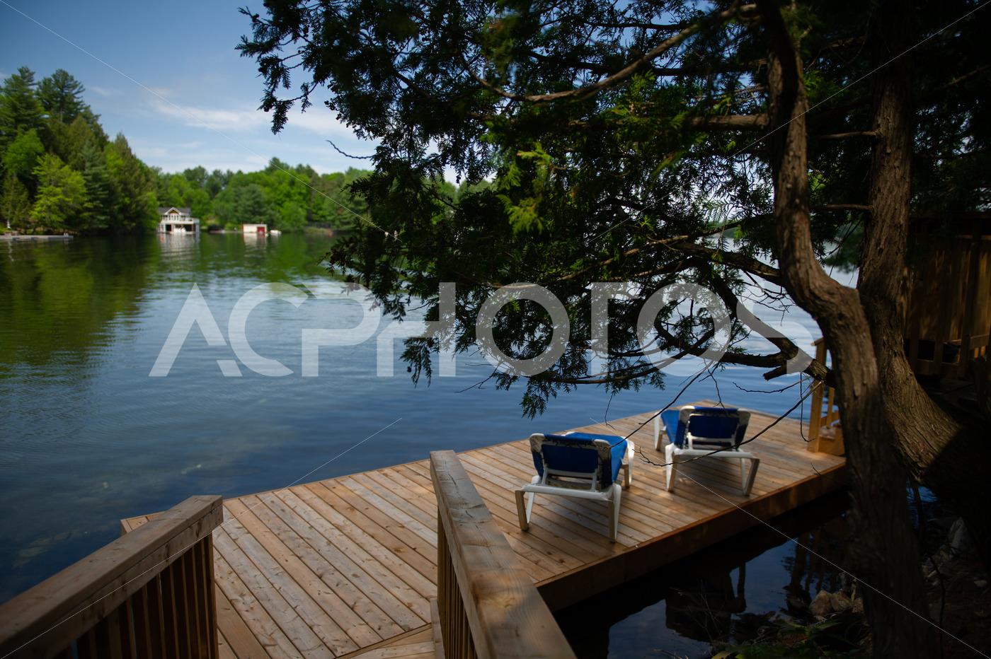 Sunbeds on a cottage wooden dock 2690