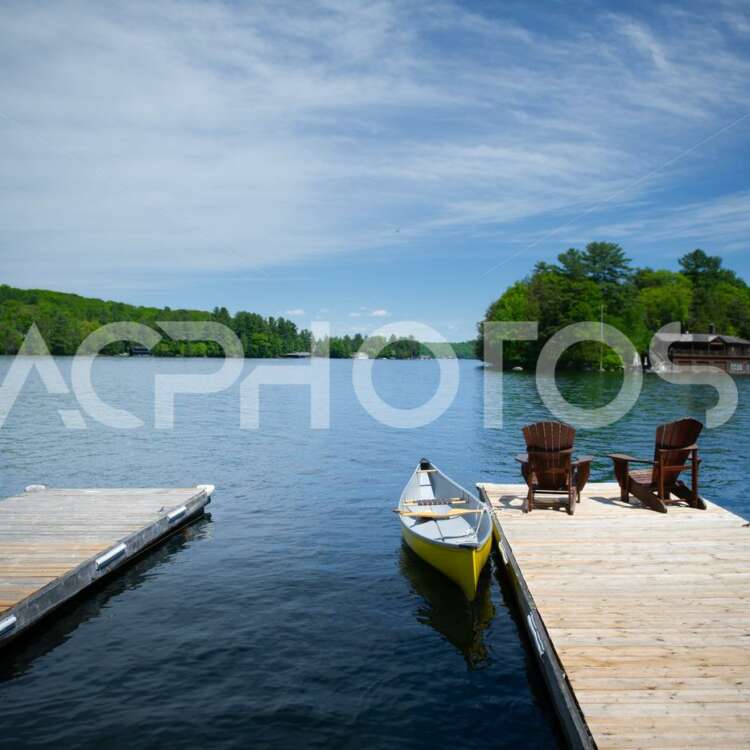 Wooden dock with Adirondack chairs 2778