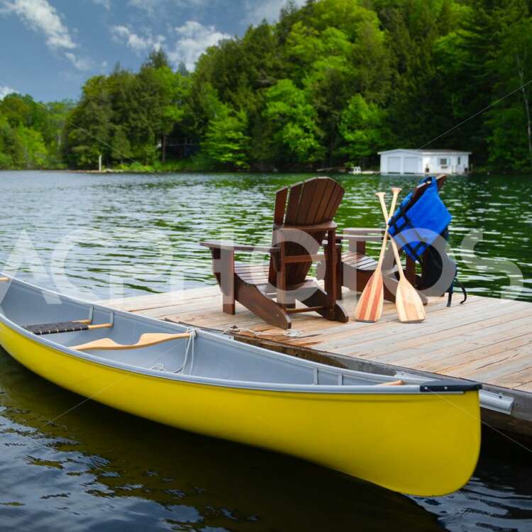 Yellow canoe with Adirondack chairs 2808