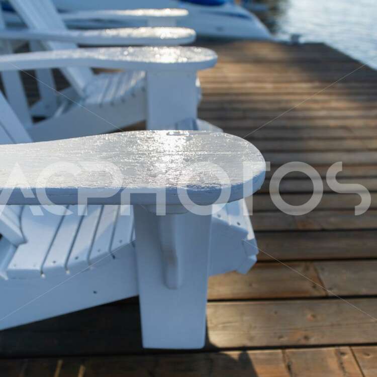 Close-up on two White Adirondack chairs - GettaPix
