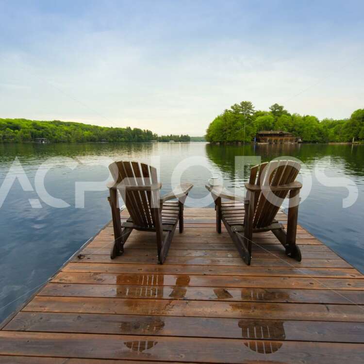 Muskoka chairs on a dock - Get A Pix