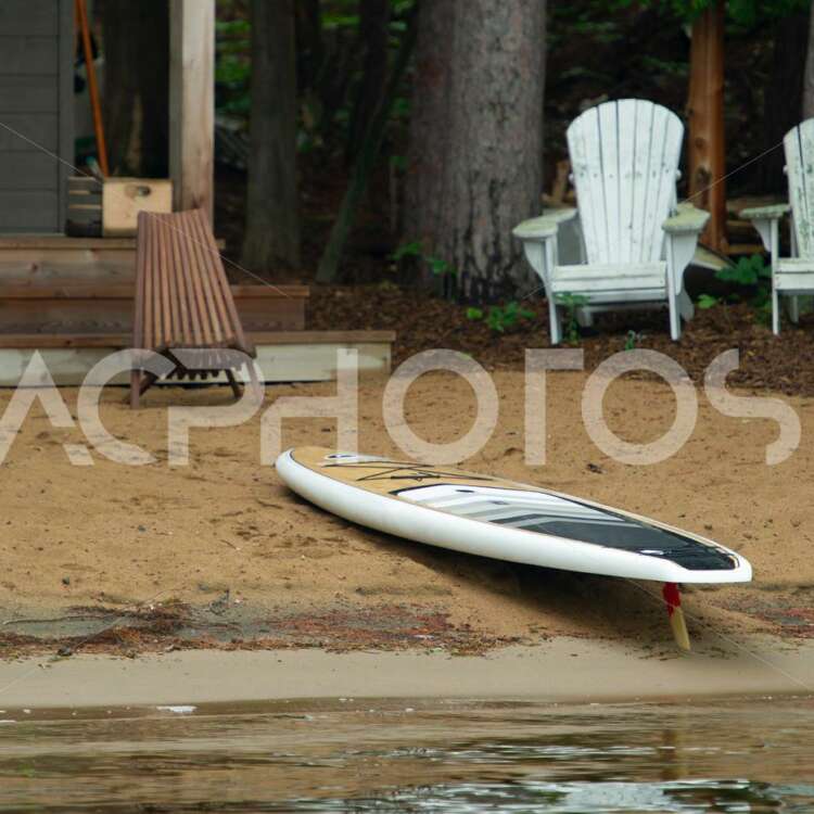 Paddle board on lake sandy beach 3518