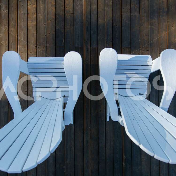 White Adirondack Chairs on a Wooden Dock View From Above - GettaPix