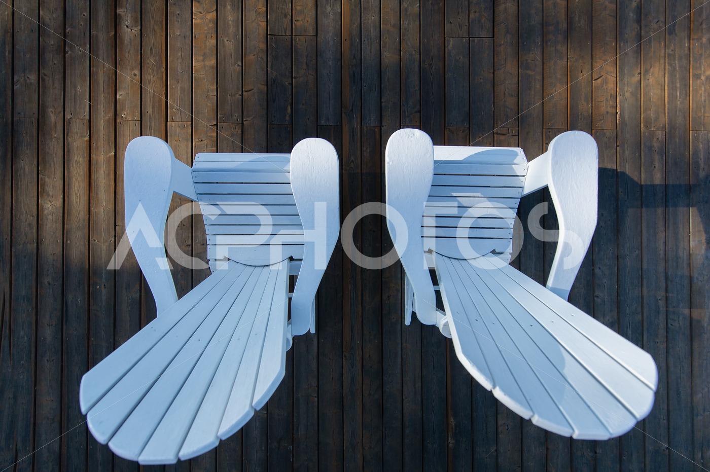 White Adirondack Chairs on a Wooden Dock View From Above 3464