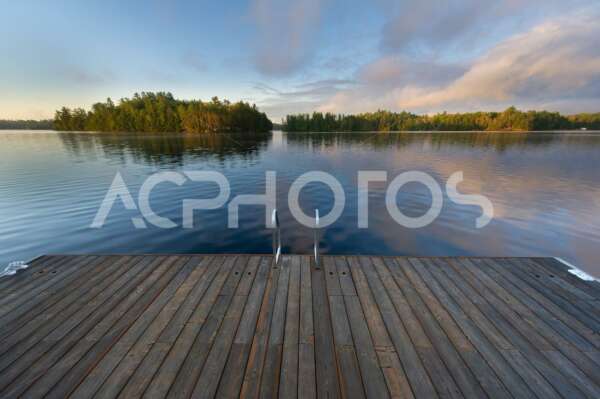 Wooden pier on a calm lake 3504