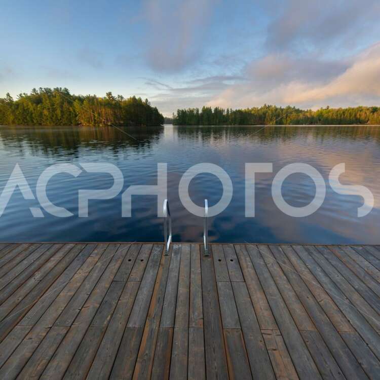 Wooden pier on a calm lake - GettaPix