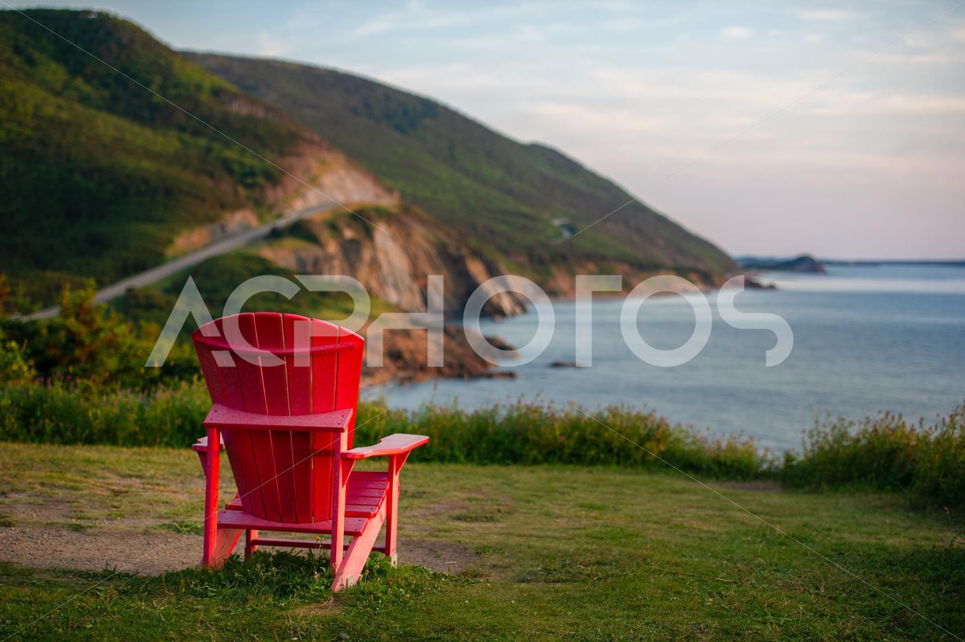 Red Adirondack chair facing the Cabot Trail - GettaPix