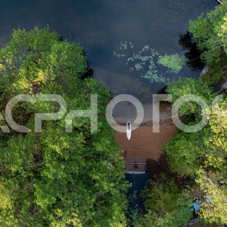 Aerial view of a sandy beach in cottage country in Muskoka. - GettaPix