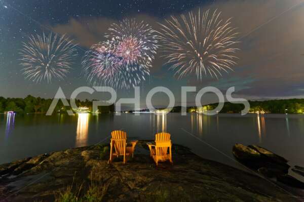 Canada Day fireworks over two Adirondack chairs  in Muskoka - GettaPix