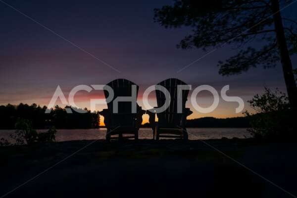 Silhouette of two Adirondack chairs - GettaPix