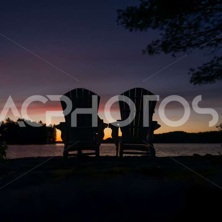 Silhouette of two Adirondack chairs - GettaPix
