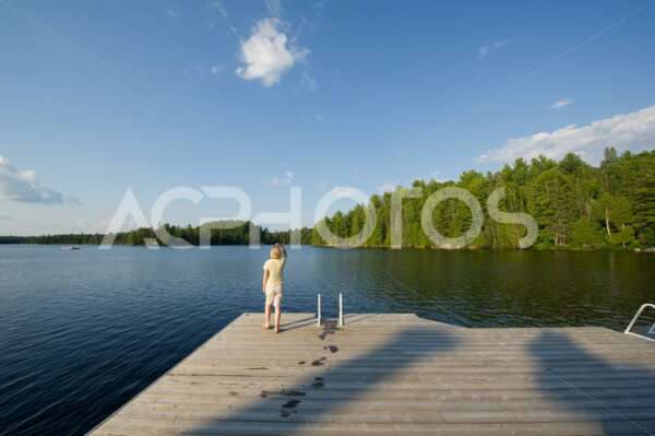 Young woman admiring the beauty of Algonquin Provincial Park in Muskoka - GettaPix